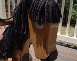 My wife helped me with the ears but I did all the rest. The mane is heavy duty yarn tied around a piece of rope and attached in a groove along the neck.