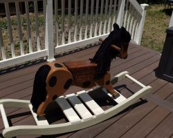 The rocker was made from 2x10's and 1x4's with 1 inch dowel rods on each end.